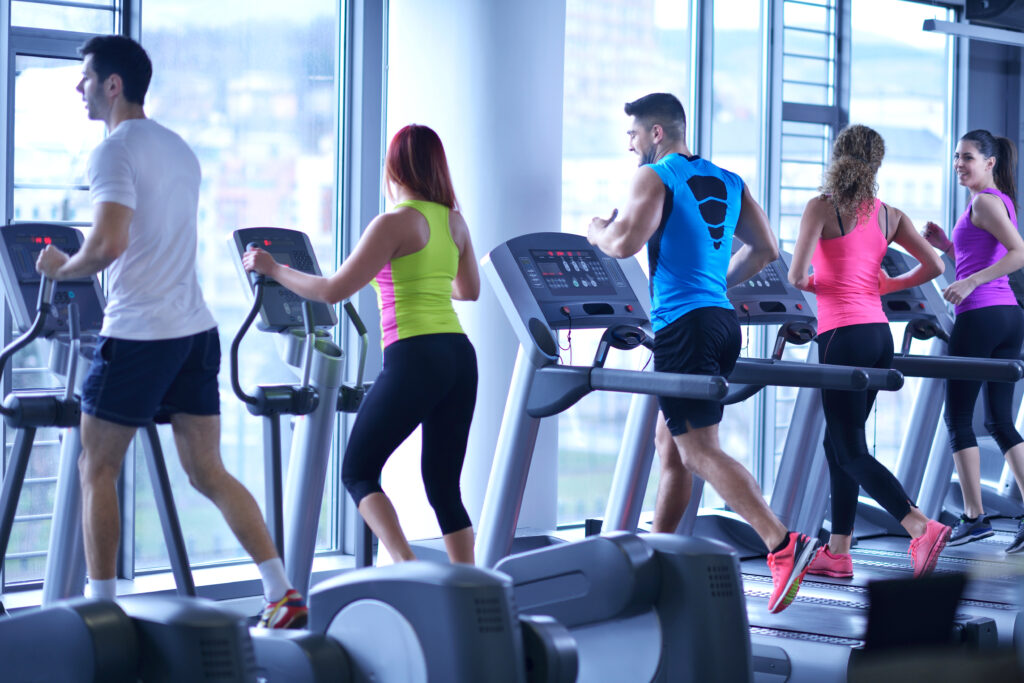 Group,Of,Young,People,Running,On,Treadmills,In,Modern,Sport